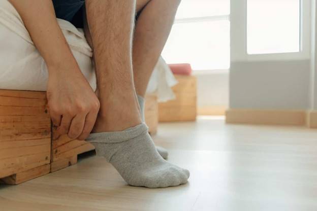 https://thewiredrunner.com/wp-content/uploads/2020/09/Putting-socks-on-2048x1365.jpg
