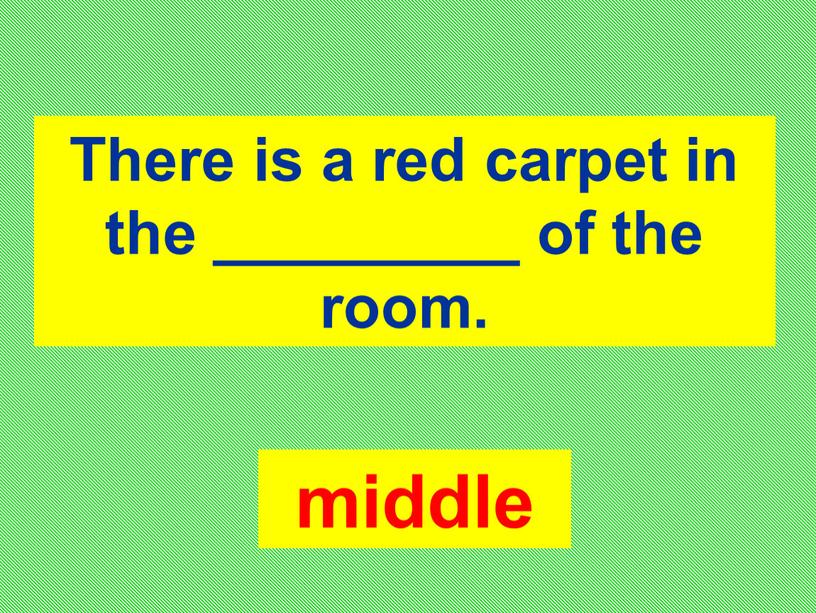There is a red carpet in the _________ of the room
