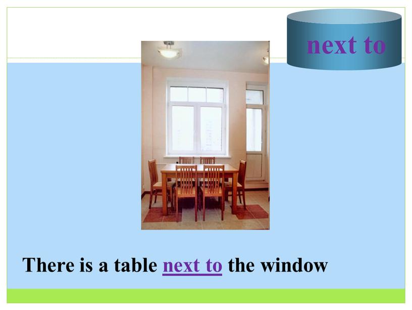 There is a table next to the window