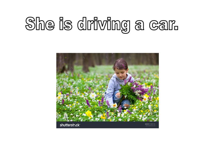 She is driving a car.